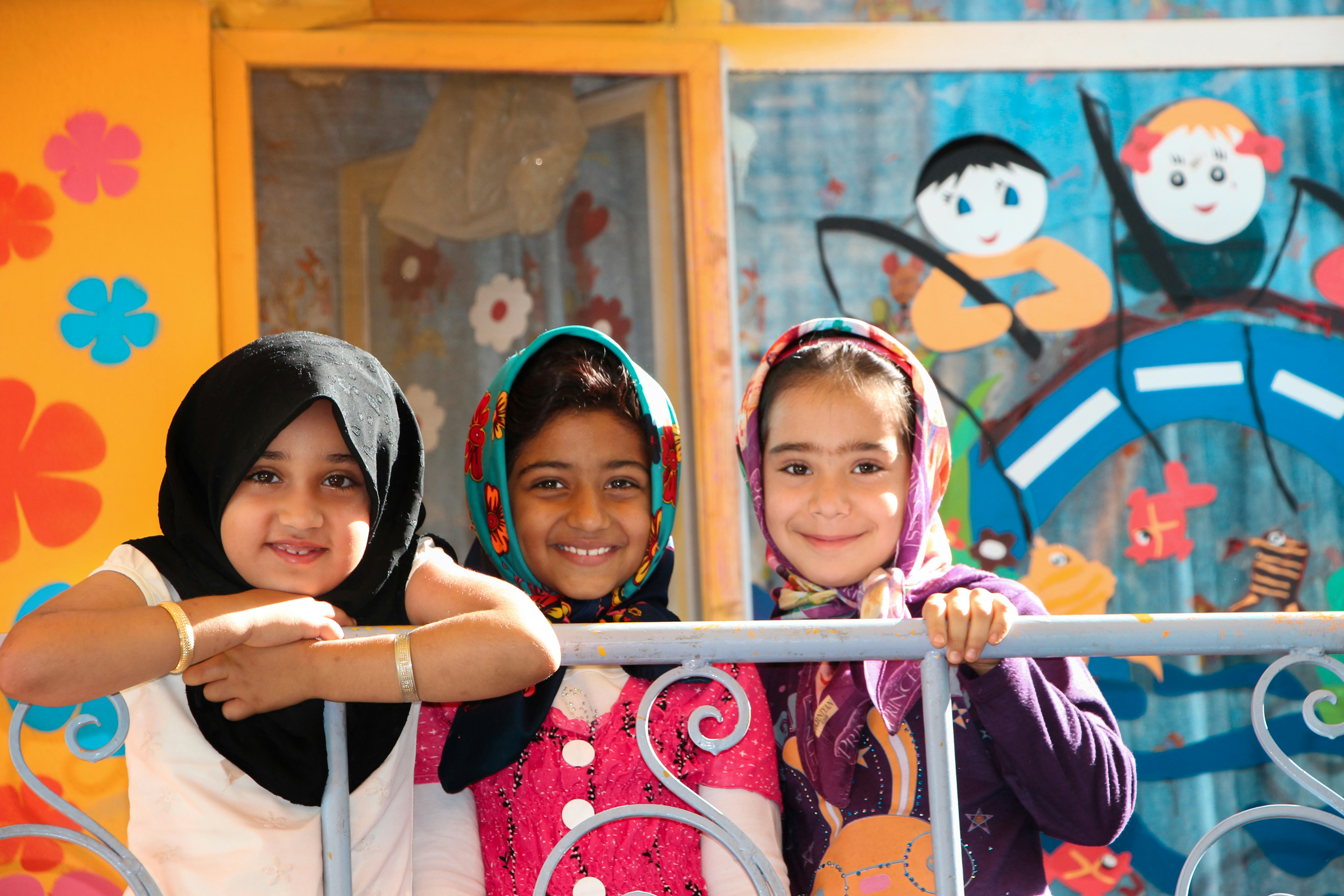 Smiling girls in colorful clothing